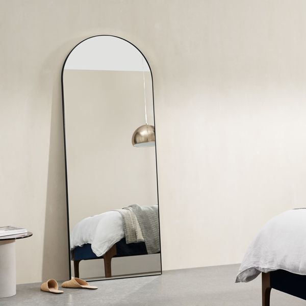 black metal framed arch mirror